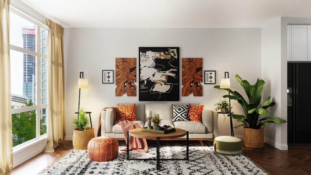 Photograph of a living room seating area with coffee table and houseplants