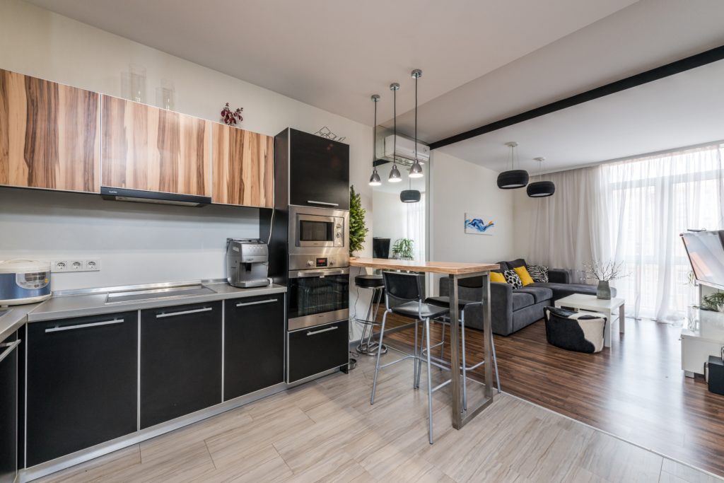 Photograph of open plan kitchen/diner/living area taken from kitchen area