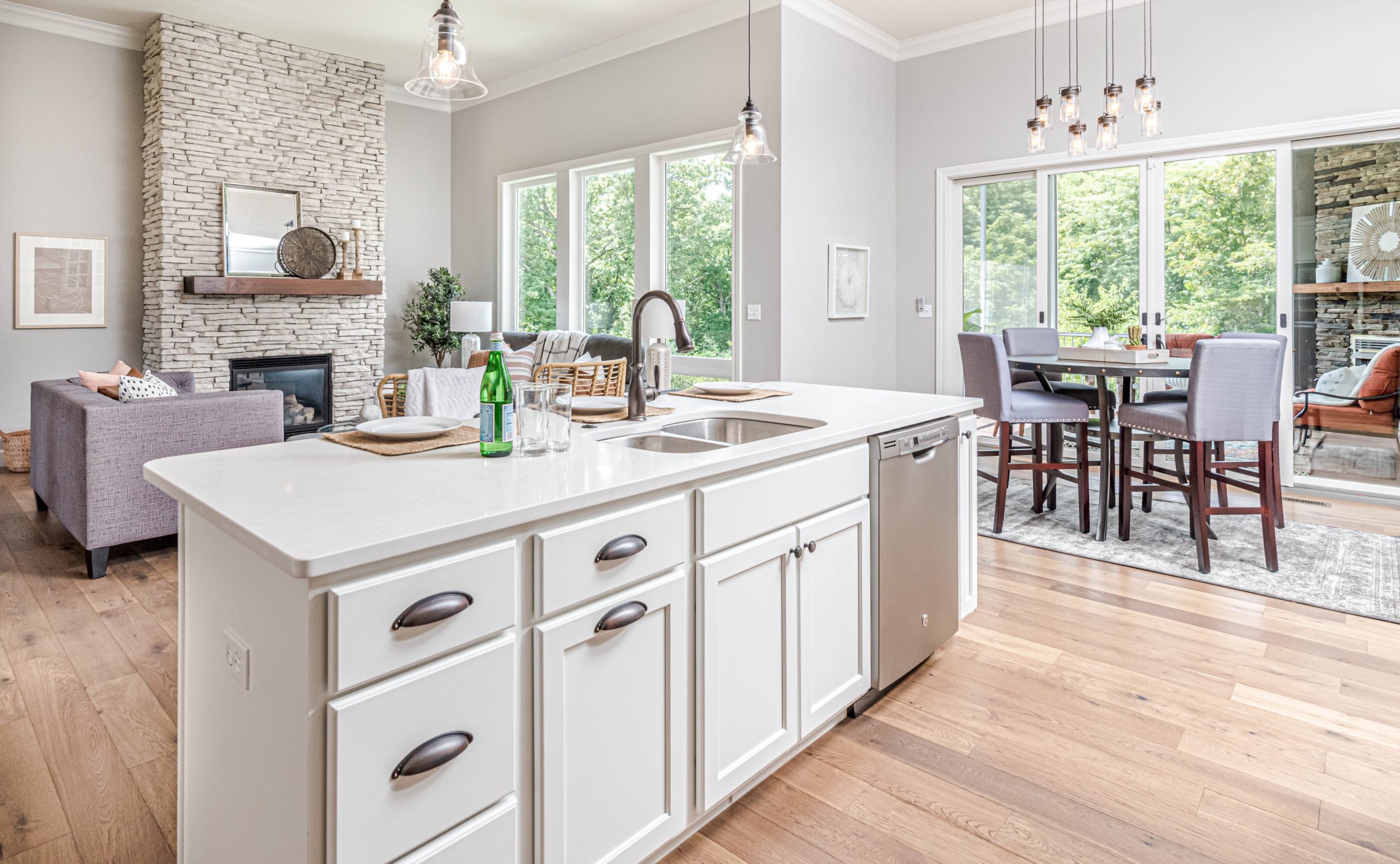 Photograph of open plan kitchen/living room/dining room taken from the kitchen area