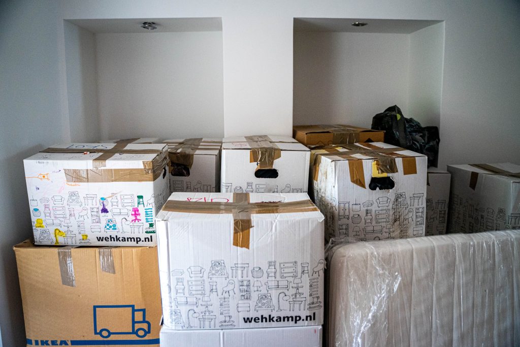 a room filled with packed boxes ready to move house
