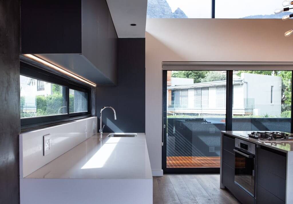 Sliding doors in a modern monochrome kitchen 